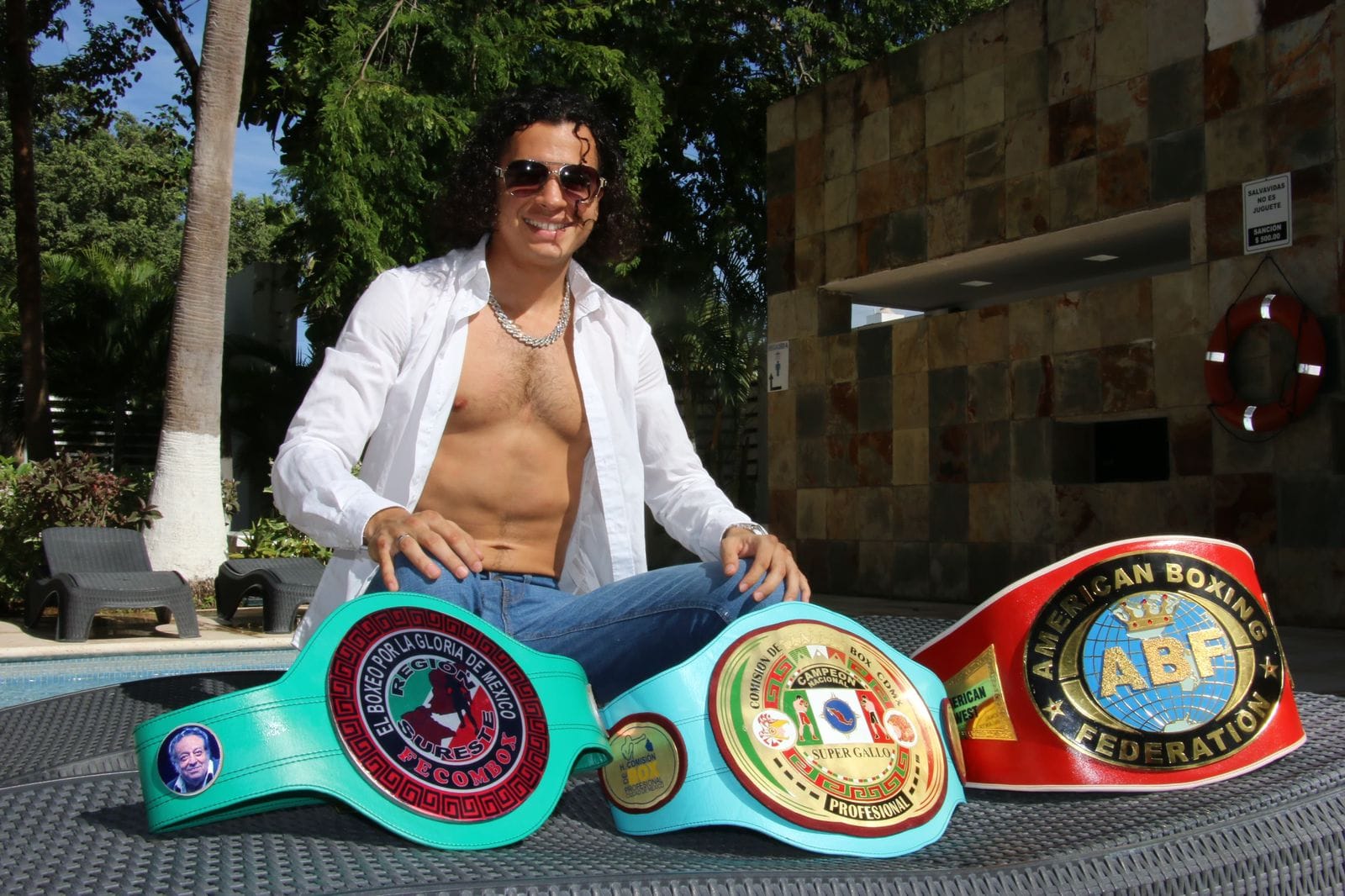 Andree Garcia with championship belts
